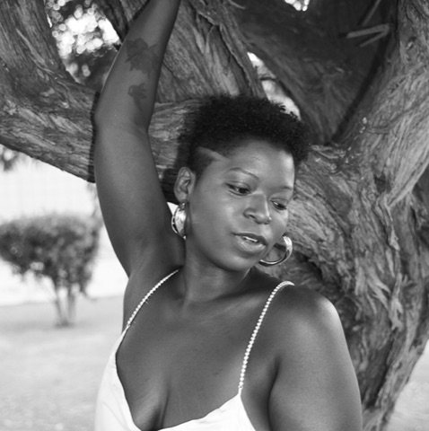 Jamila Lightfoot, black-and-white portrait under a tree